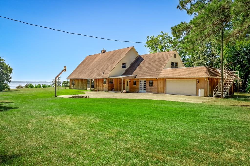 10307 Pirogue Road Oil City, LA 71061 - Photo 4 of 39 a view of a house with a big yard