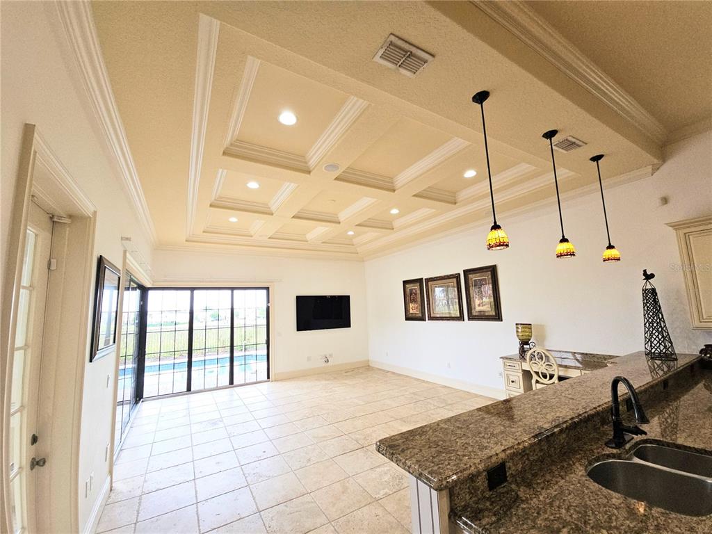 420 Muirfield Loop Reunion, FL 34747 - Photo 11 of 60 a view of a kitchen with a sink and living room view
