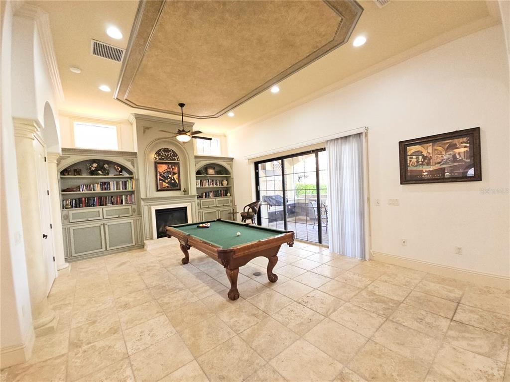 420 Muirfield Loop Reunion, FL 34747 - Photo 15 of 60 a living room with patio furniture