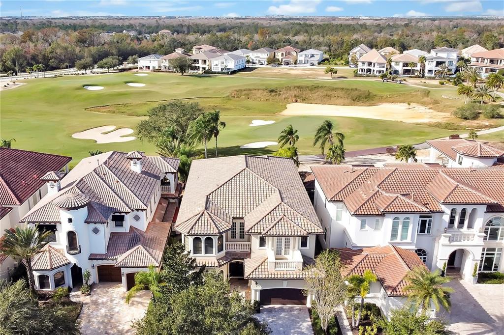 420 Muirfield Loop Reunion, FL 34747 - Photo 2 of 60 an aerial view of residential houses with outdoor space