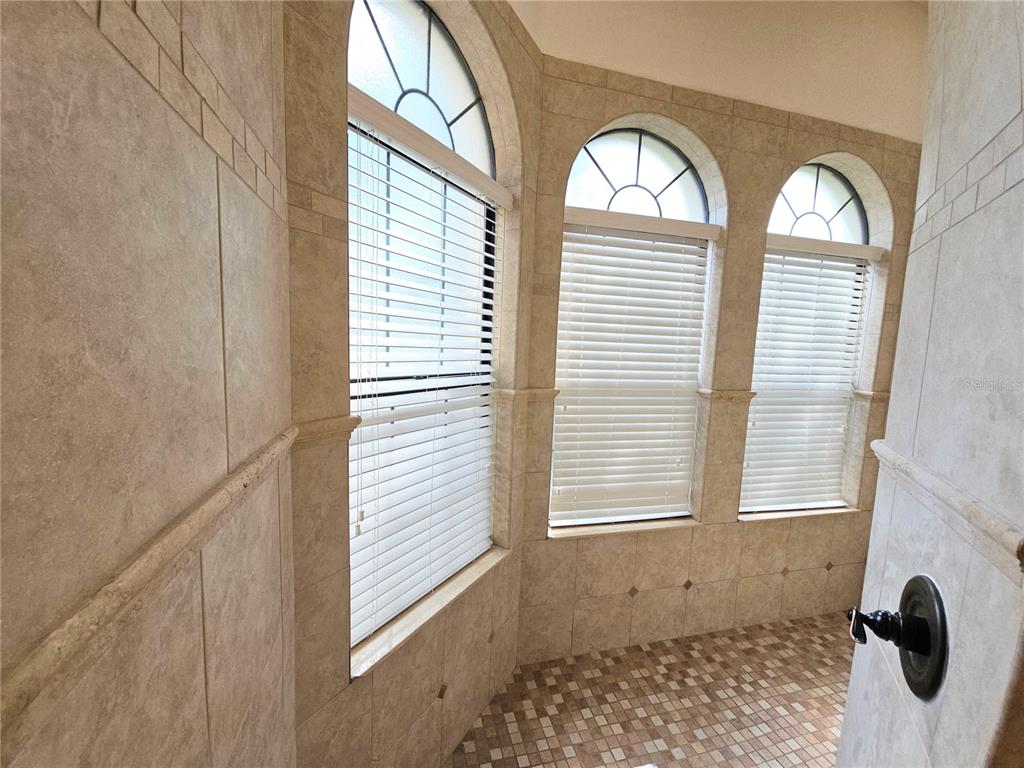420 Muirfield Loop Reunion, FL 34747 - Photo 24 of 60 a view of a bathroom with windows