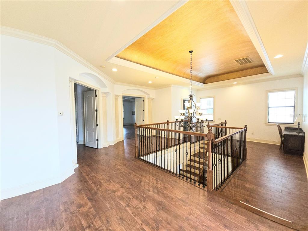 420 Muirfield Loop Reunion, FL 34747 - Photo 32 of 60 a view of a hallway with stairs and a couch