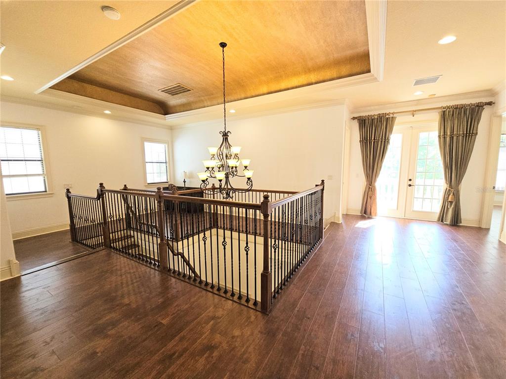 420 Muirfield Loop Reunion, FL 34747 - Photo 48 of 60 a view of an empty room and wooden floor