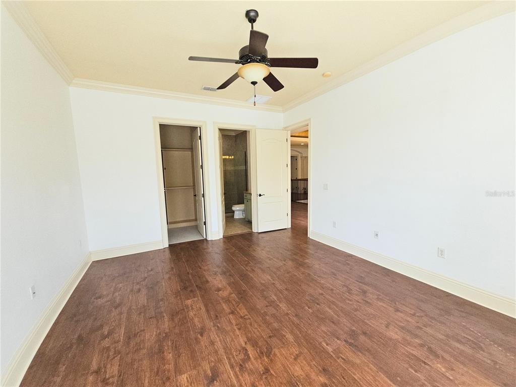 420 Muirfield Loop Reunion, FL 34747 - Photo 50 of 60 a view of empty room with wooden floor