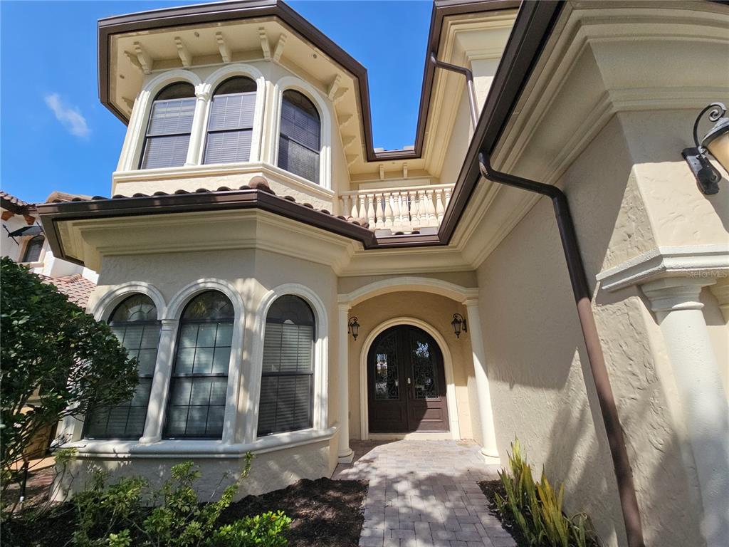 420 Muirfield Loop Reunion, FL 34747 - Photo 6 of 60 a view of a building with a balcony