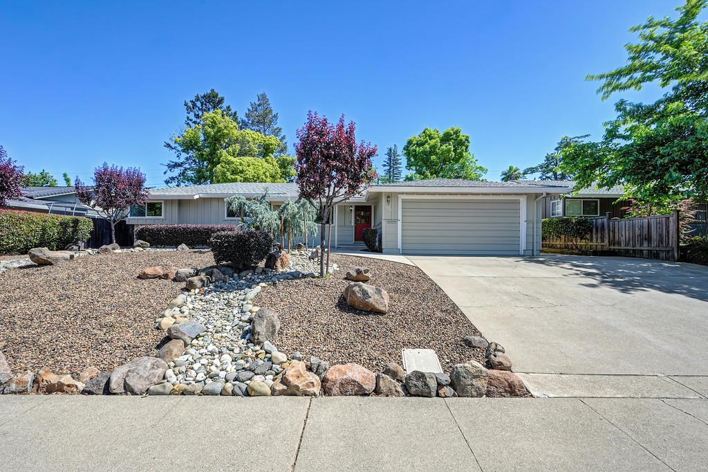 5824 Hesper Way Carmichael, CA 95608 - Photo 16 of 56 a view of a house with a yard and potted plants