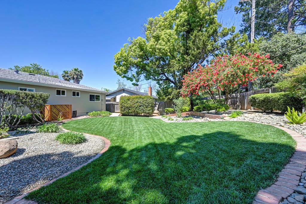5824 Hesper Way Carmichael, CA 95608 - Photo 22 of 56 a front view of a house with a yard