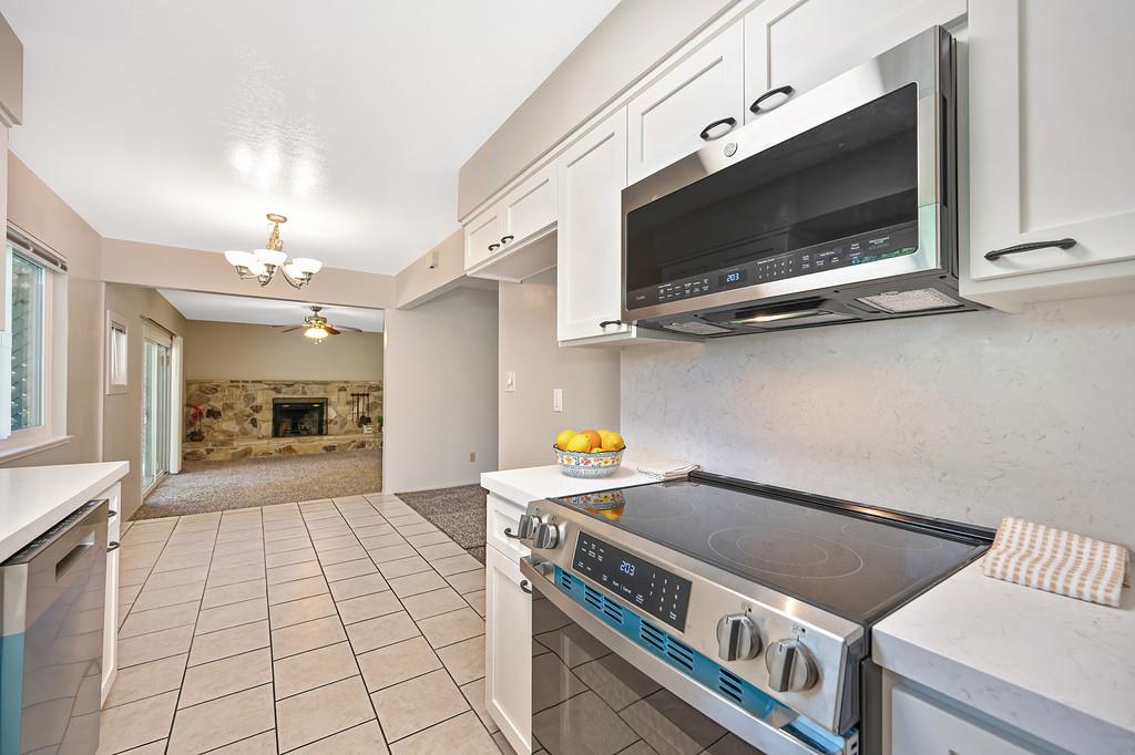 5824 Hesper Way Carmichael, CA 95608 - Photo 32 of 56 a kitchen with a stove and a microwave