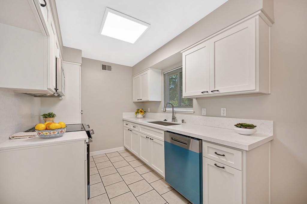 5824 Hesper Way Carmichael, CA 95608 - Photo 34 of 56 a kitchen with stainless steel appliances granite countertop a sink stove and cabinets