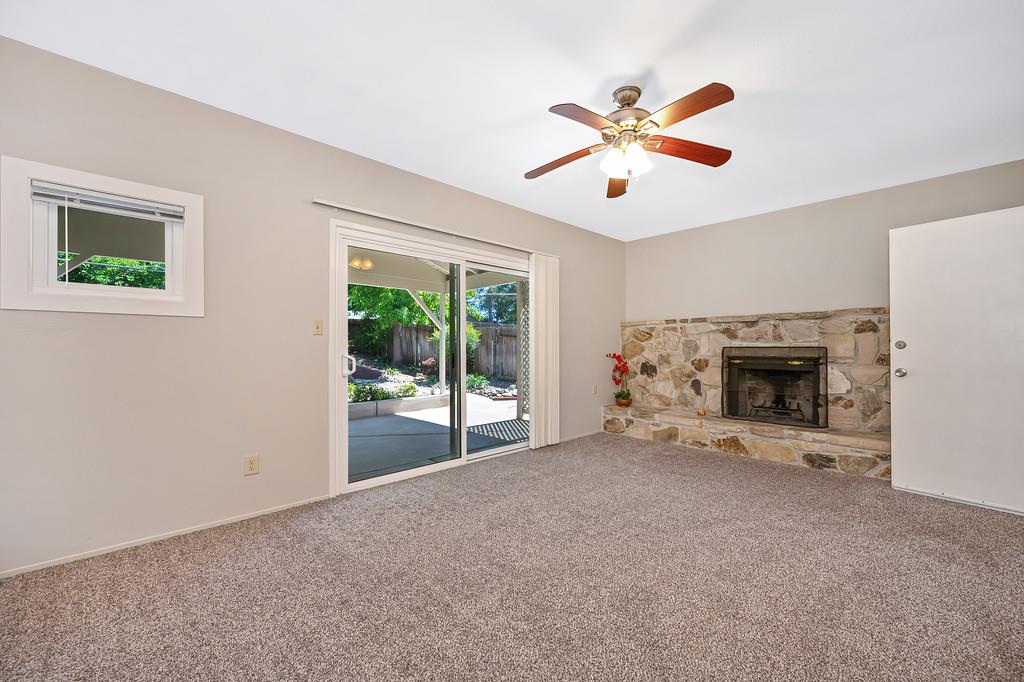 5824 Hesper Way Carmichael, CA 95608 - Photo 46 of 56 a view of an empty room with window and fireplace