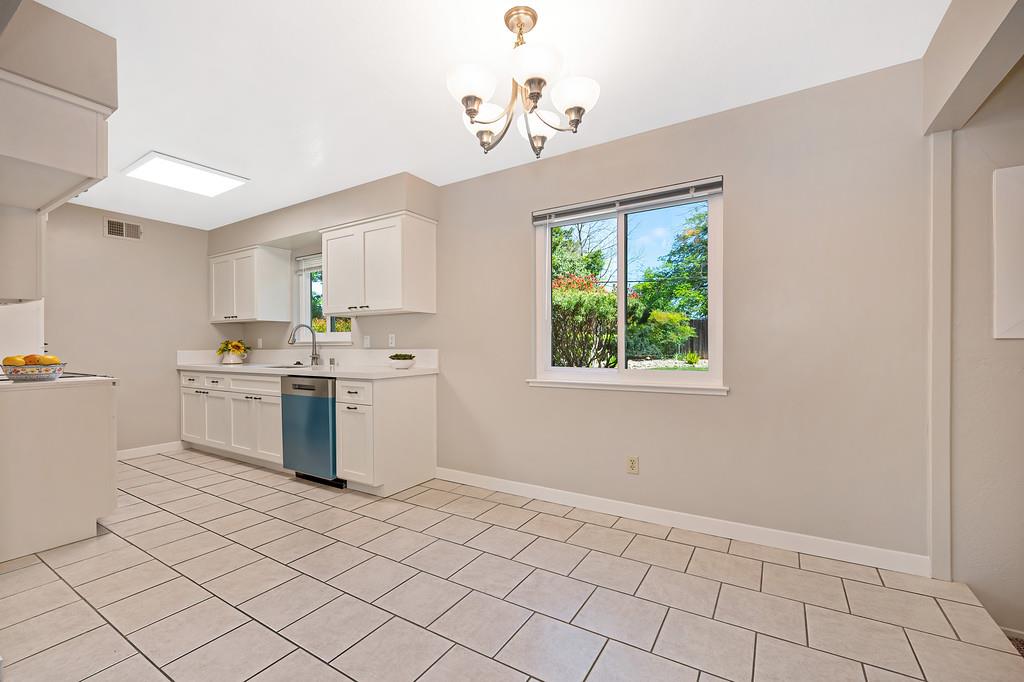 5824 Hesper Way Carmichael, CA 95608 - Photo 49 of 56 a kitchen with a sink cabinets and window