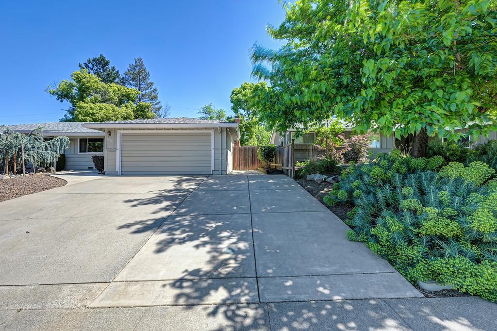 5824 Hesper Way Carmichael, CA 95608 - Photo 55 of 56 a view of a house with a small yard and garage