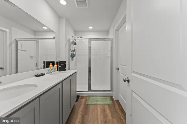 a kitchen with a sink refrigerator and window