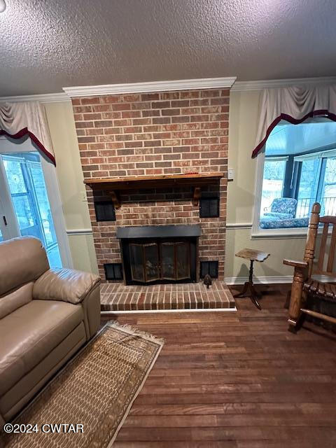 591 Asbury Road Camden, TN 38320 - Photo 11 of 38 a living room with furniture a fireplace and a table