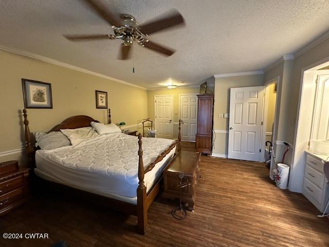 591 Asbury Road Camden, TN 38320 - Photo 14 of 38 a bed room with a bed and a chandelier