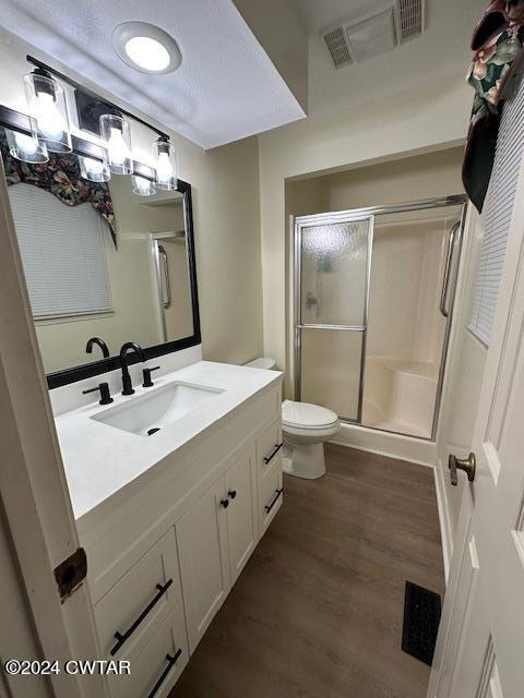 591 Asbury Road Camden, TN 38320 - Photo 17 of 38 a bathroom with a double vanity sink toilet and mirror