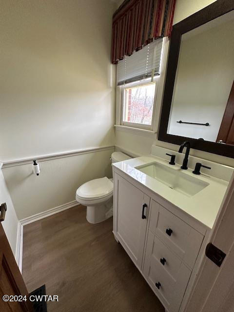 591 Asbury Road Camden, TN 38320 - Photo 19 of 38 a bathroom with a sink a toilet and a mirror