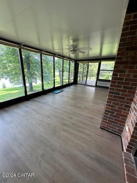 591 Asbury Road Camden, TN 38320 - Photo 27 of 38 a view of an empty room with a window and wooden floor