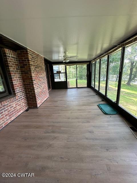 591 Asbury Road Camden, TN 38320 - Photo 29 of 38 a view of an empty room with a window and wooden floor