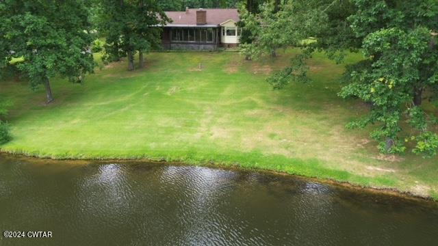 591 Asbury Road Camden, TN 38320 - Photo 33 of 38 a view of a lake with a yard