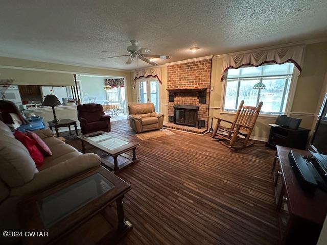 591 Asbury Road Camden, TN 38320 - Photo 10 of 38 a living room with furniture and a fireplace