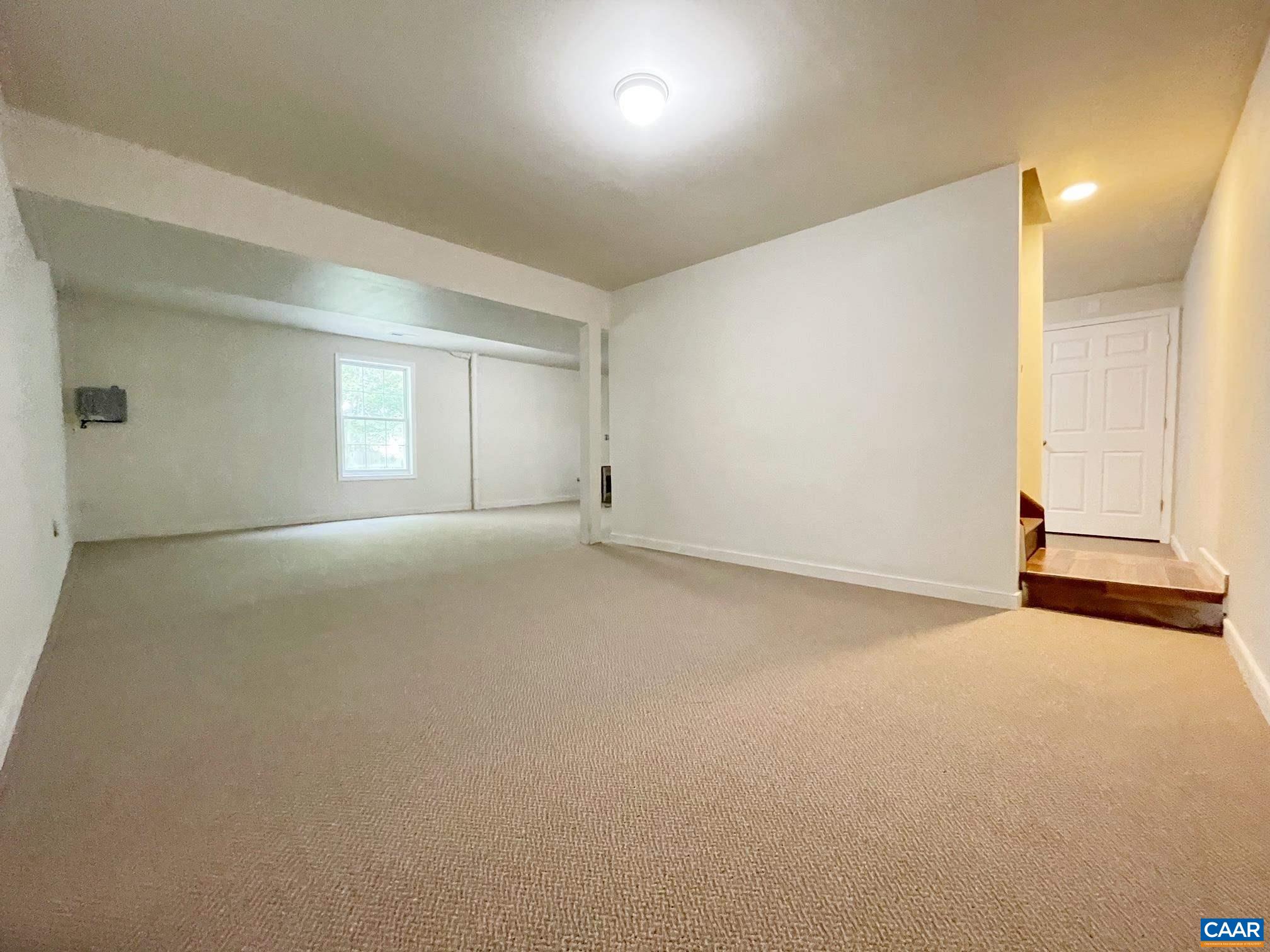 81 Phlox Road Ruckersville, VA 22968 - Photo 17 of 24 an empty room with a natural light