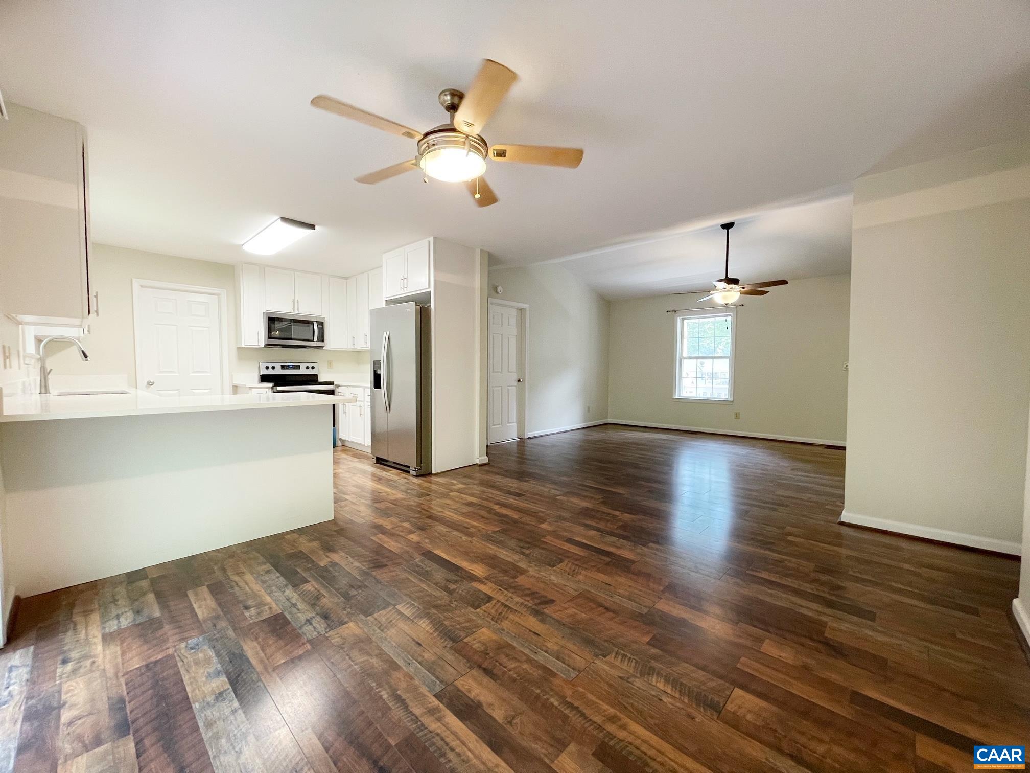 81 Phlox Road Ruckersville, VA 22968 - Photo 5 of 24 a view of a kitchen with a dishwasher cabinets and wooden floor