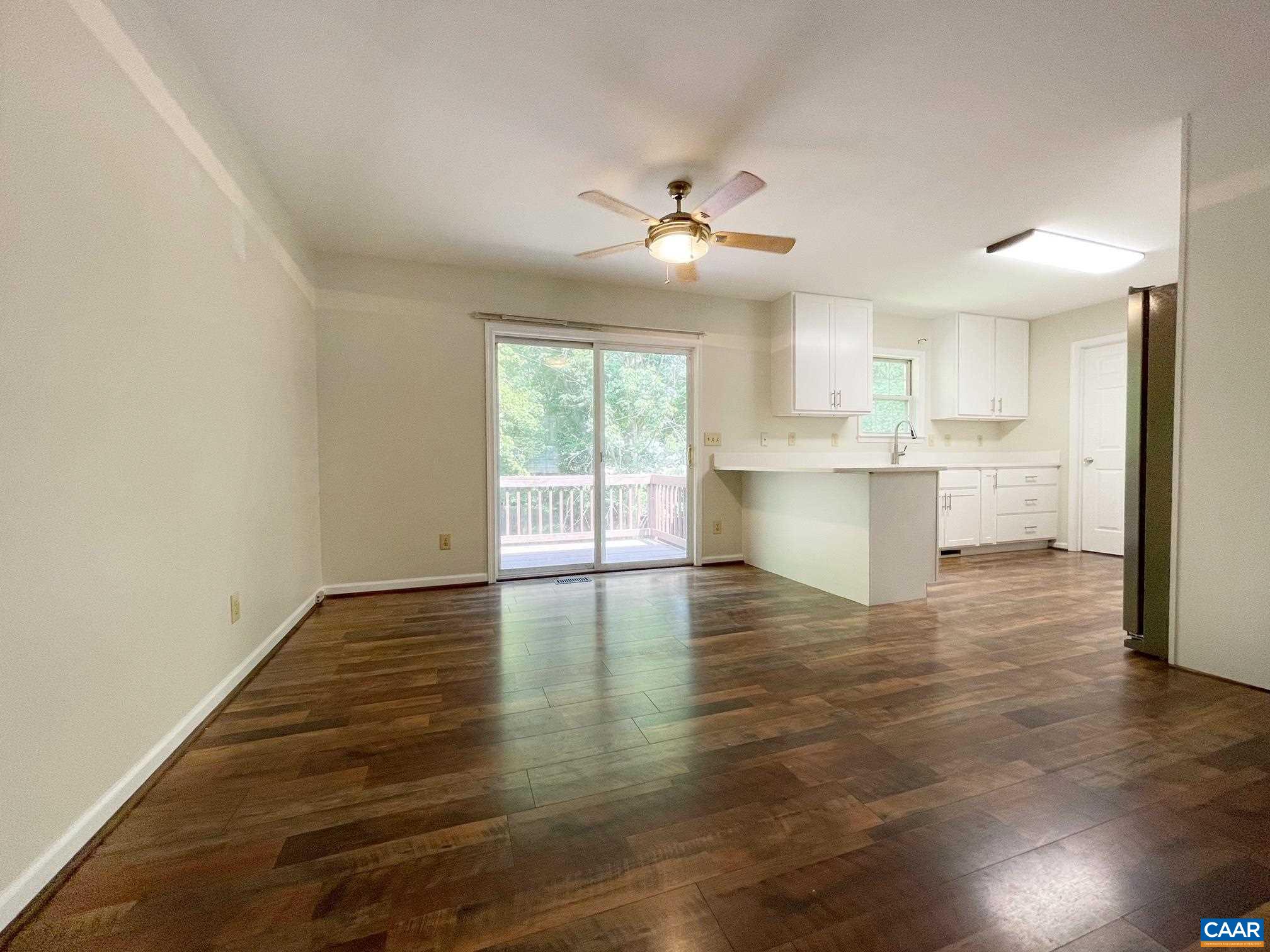 81 Phlox Road Ruckersville, VA 22968 - Photo 6 of 24 a view of a kitchen with wooden floor and a window