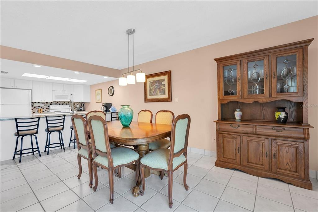 19610 Gulf Boulevard, Unit 308 Indian Rocks Beach, FL 33785 - Photo 14 of 41 a view of a dining room with furniture