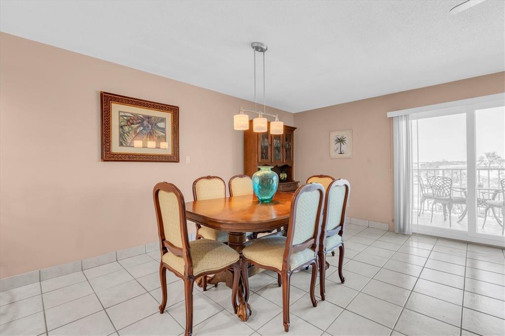 19610 Gulf Boulevard, Unit 308 Indian Rocks Beach, FL 33785 - Photo 15 of 41 a dining room with furniture and window