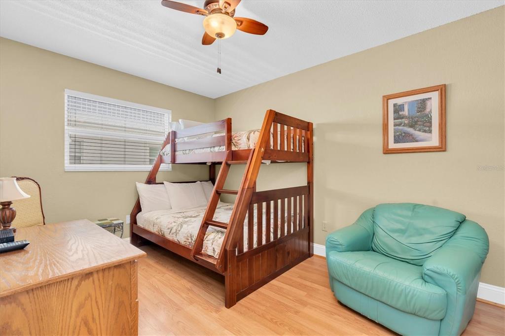 19610 Gulf Boulevard, Unit 308 Indian Rocks Beach, FL 33785 - Photo 20 of 41 a bedroom with a bed couch and window