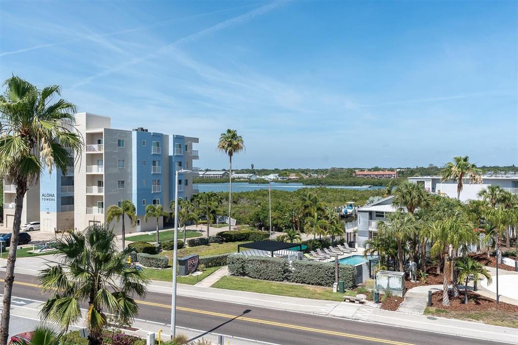 19610 Gulf Boulevard, Unit 308 Indian Rocks Beach, FL 33785 - Photo 26 of 41 a view of a swimming pool and outdoor seating