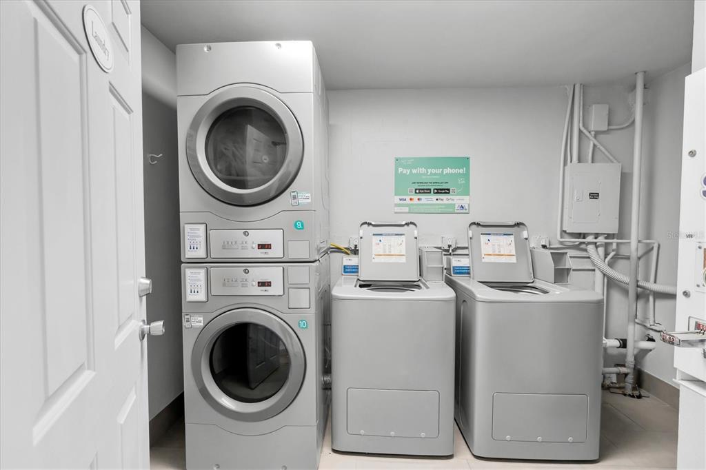 19610 Gulf Boulevard, Unit 308 Indian Rocks Beach, FL 33785 - Photo 31 of 41 a view of a storage and utility room with washer and dryer