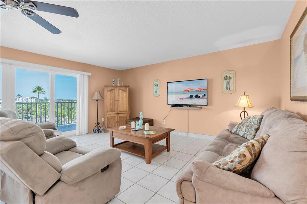 19610 Gulf Boulevard, Unit 308 Indian Rocks Beach, FL 33785 - Photo 6 of 41 a living room with furniture and a large window