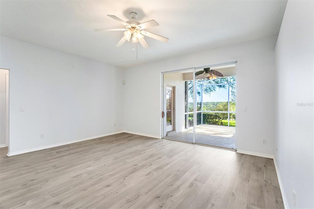 3984 Beacon Ridge Way Clermont, FL 34711 - Photo 24 of 59 Family Room with view of Patio