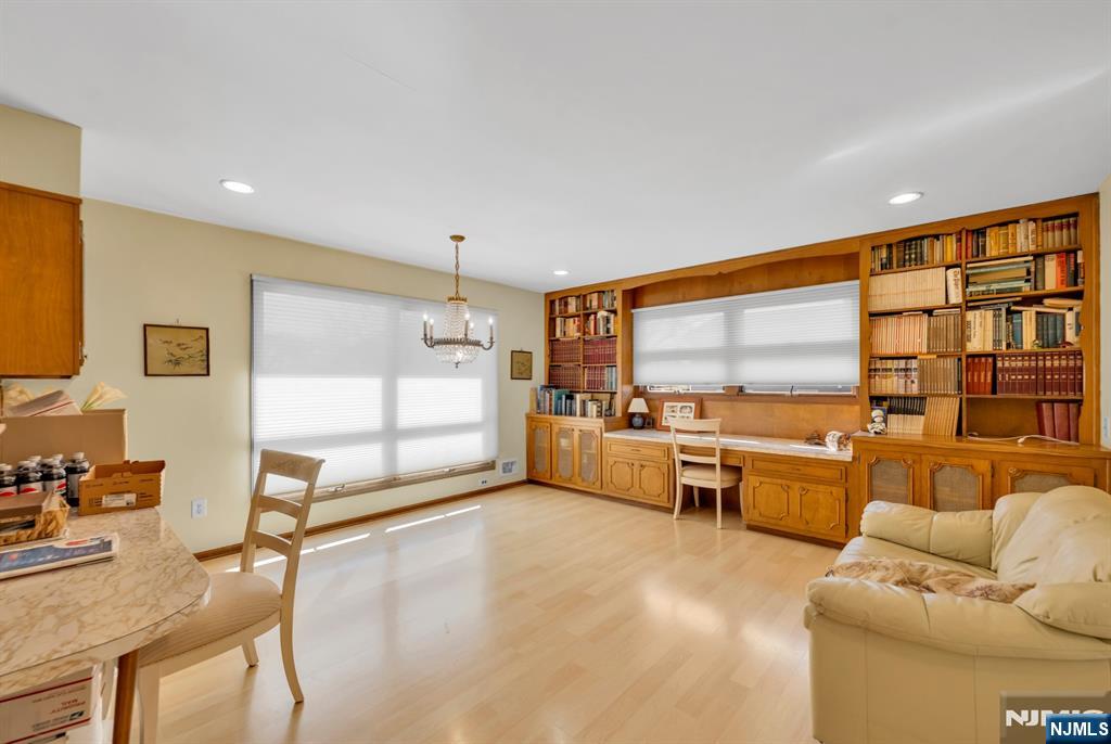 204 Tryon Place Paramus, NJ 07652 - Photo 12 of 33 a living room with furniture and a flat screen tv