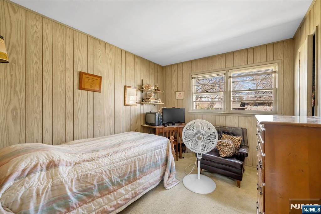 204 Tryon Place Paramus, NJ 07652 - Photo 16 of 33 a bedroom with a bed workspace and window