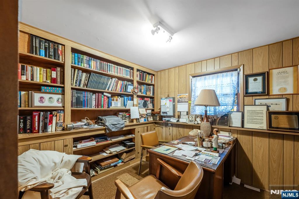 204 Tryon Place Paramus, NJ 07652 - Photo 24 of 33 a reading room with furniture and a book shelf