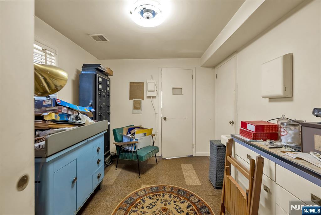 204 Tryon Place Paramus, NJ 07652 - Photo 25 of 33 a kitchen that has a sink and a stove in it