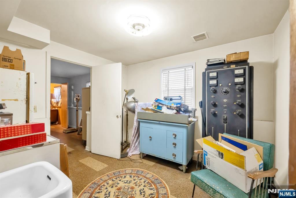 204 Tryon Place Paramus, NJ 07652 - Photo 29 of 33 a room with furniture a rug and a window