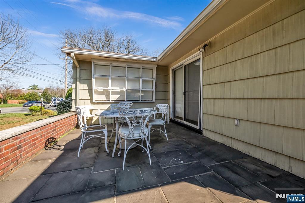 204 Tryon Place Paramus, NJ 07652 - Photo 30 of 33 a patio with table and chairs