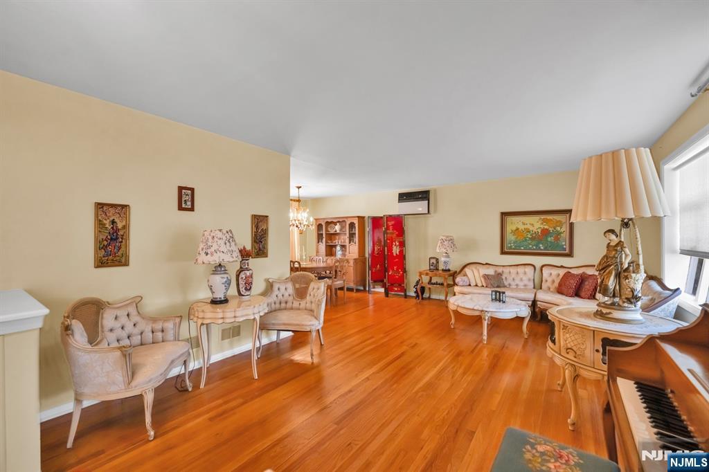 204 Tryon Place Paramus, NJ 07652 - Photo 4 of 33 a living room with furniture and a wooden floor