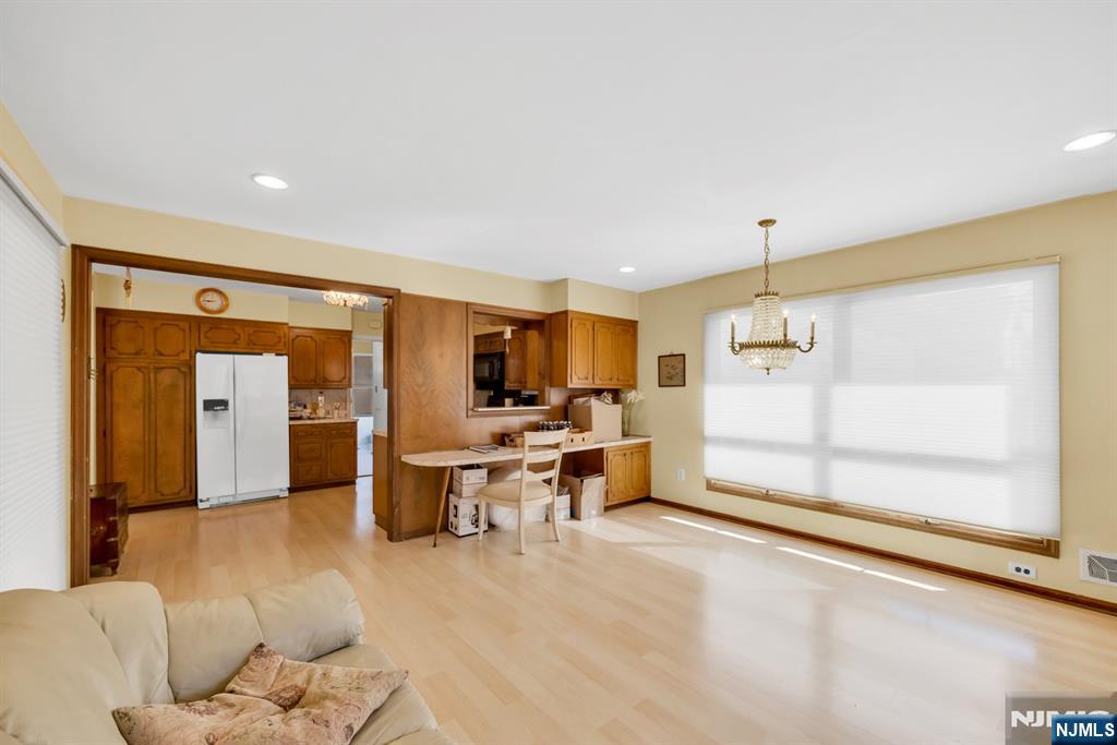 204 Tryon Place Paramus, NJ 07652 - Photo 8 of 33 a view of a living room hardwood and a kitchen
