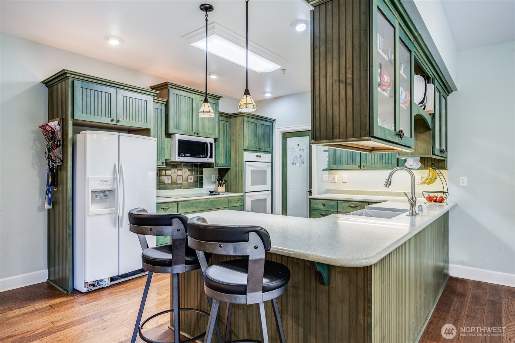 36612 2nd Avenue South Roy, WA 98580 - Photo 13 of 40 a kitchen that has a table chairs and a refrigerator
