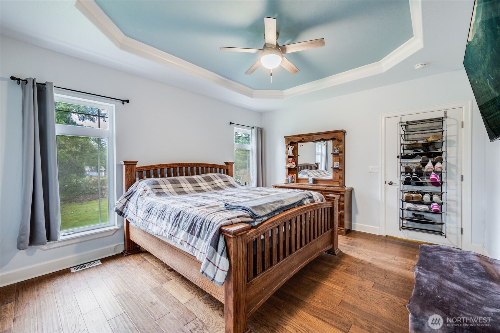 36612 2nd Avenue South Roy, WA 98580 - Photo 23 of 40 a bedroom with a large bed a chandelier and dresser