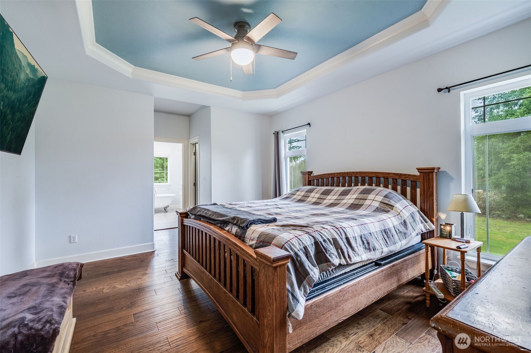 36612 2nd Avenue South Roy, WA 98580 - Photo 24 of 40 a bedroom with a bed and a chandelier