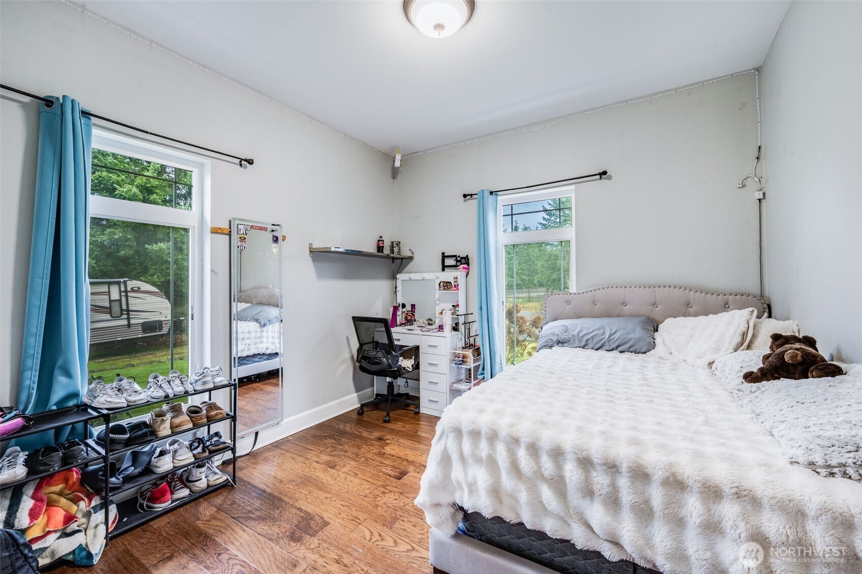 36612 2nd Avenue South Roy, WA 98580 - Photo 27 of 40 a bedroom with a bed and large windows