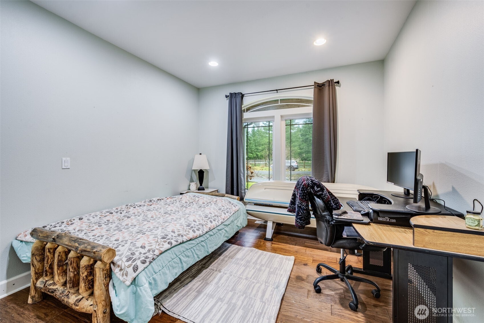 36612 2nd Avenue South Roy, WA 98580 - Photo 28 of 40 a bedroom with a bed a chair and a large window