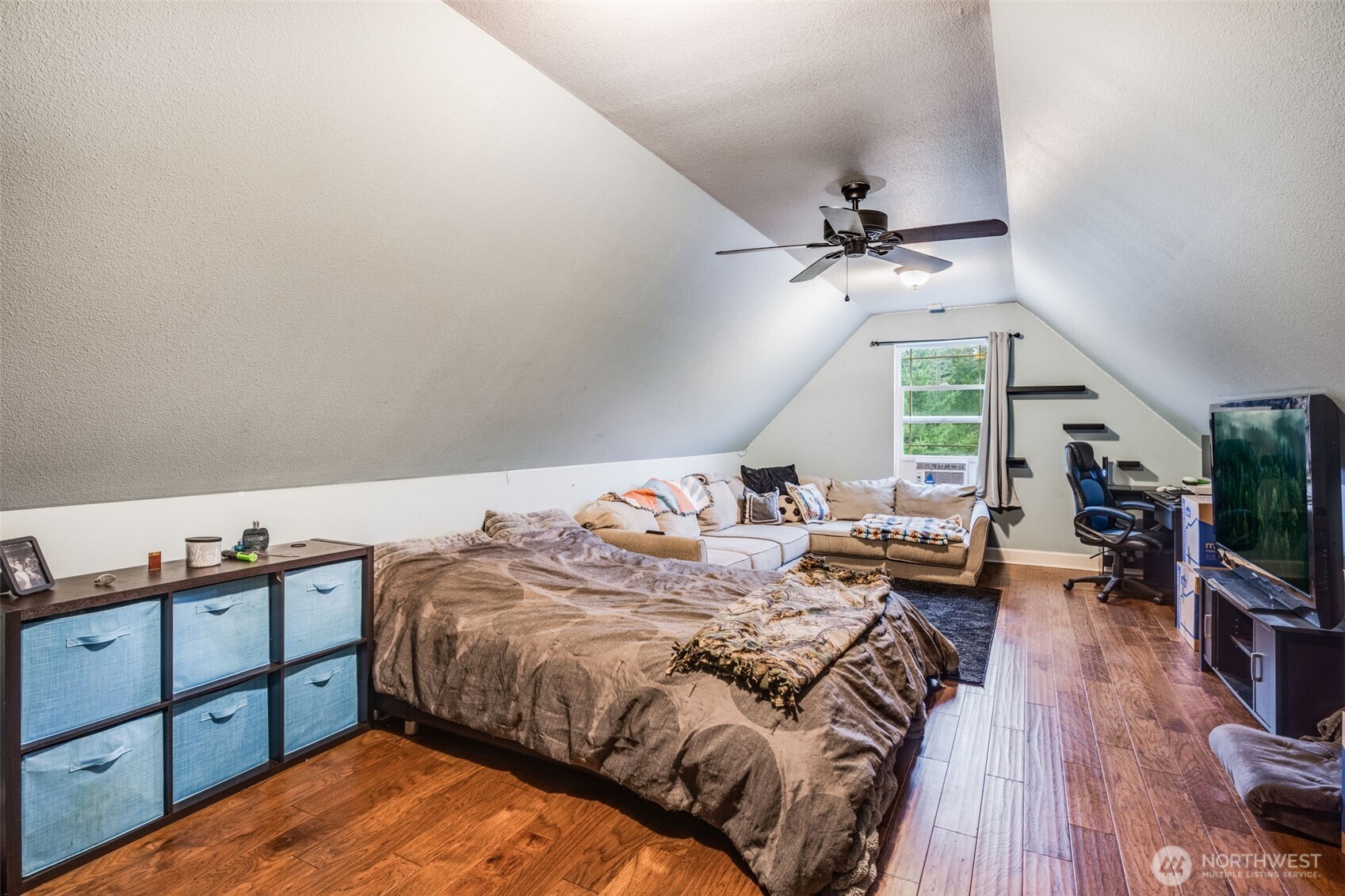 36612 2nd Avenue South Roy, WA 98580 - Photo 30 of 40 a bed room with a bed and a chandelier
