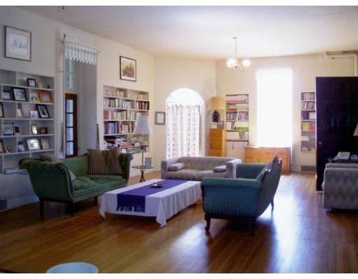 62 Buckminster Road Brookline, MA 02445 - Photo 9 of 9 a living room with furniture and a flat screen tv